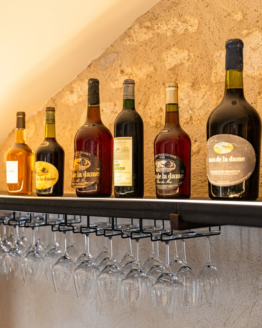 Photo by Mas De La Dame on March 03, 2026. May be an image of wine, wine bottle, rack, bottle, indoors and text.