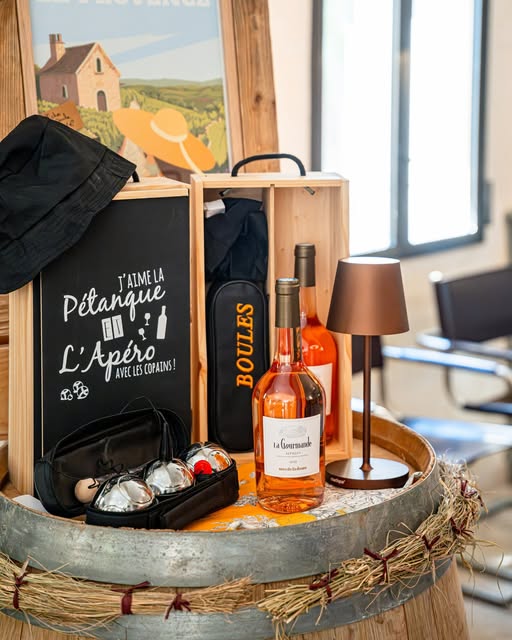 Photo by Mas De La Dame on June 14, 2026. May be an image of wine, basket, hamper, flask and text.