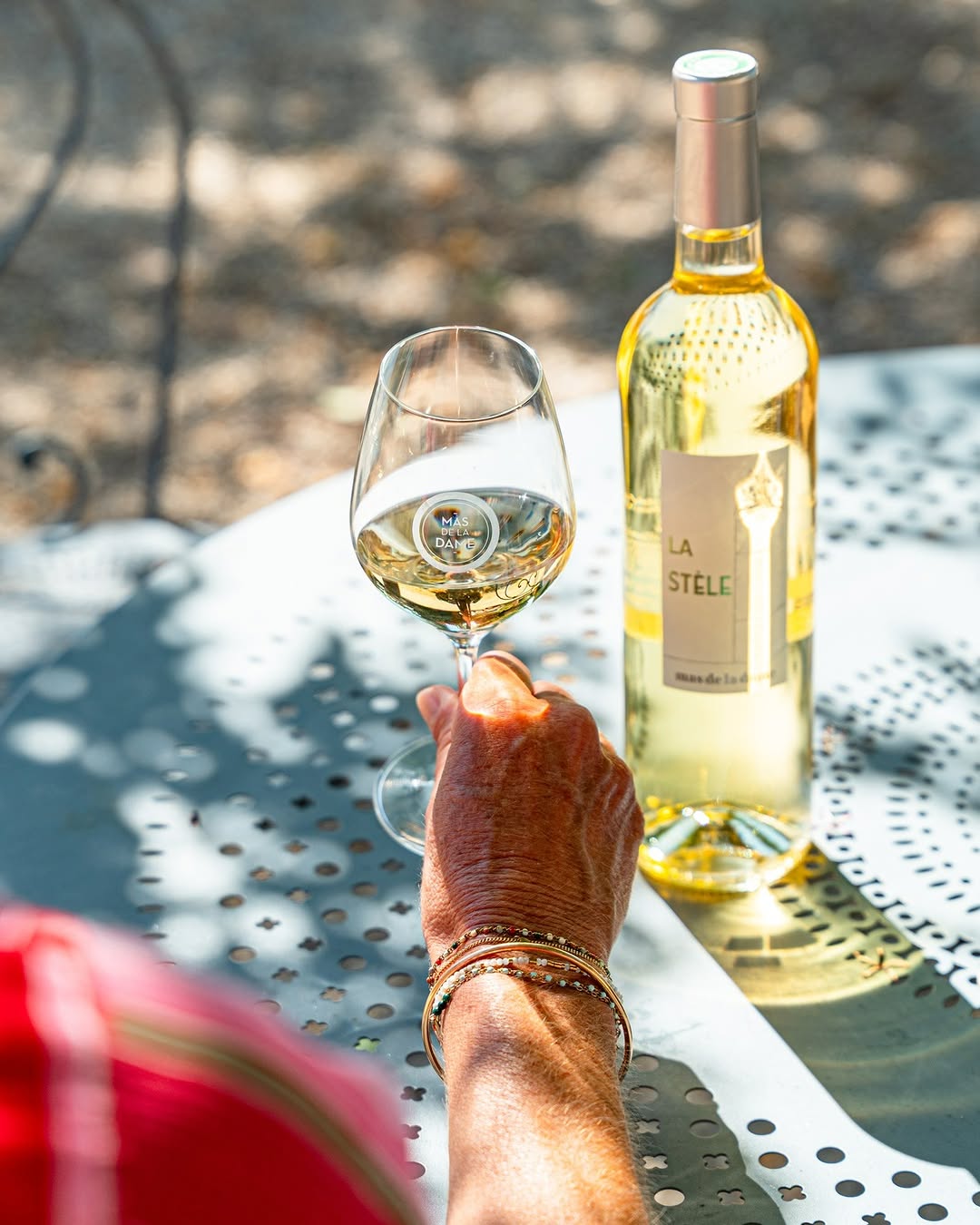 Photo by Mas De La Dame on July 29, 2026. May be an image of wine, wine glass, wine bottle and text.