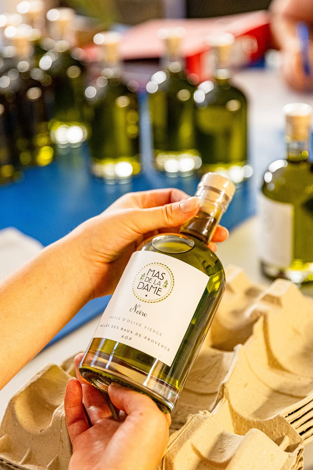 Photo by Mas De La Dame on April 08, 2026. May be an image of wine bottle, bottle, olive oil and text.